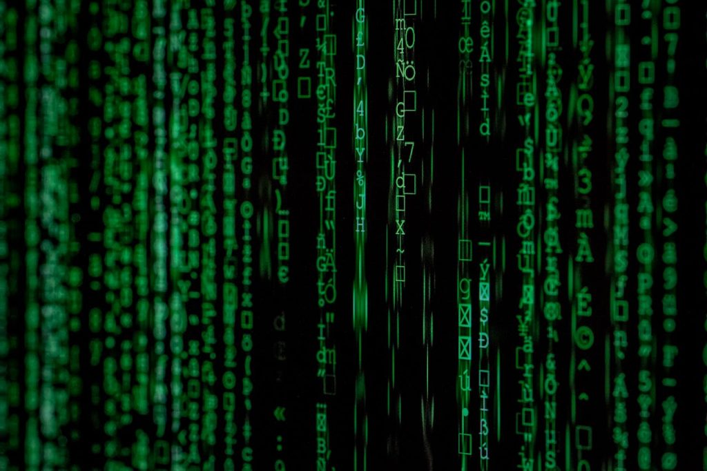 close-up-photo-of-matrix-background-1089438 Abstract green matrix code background with binary style.